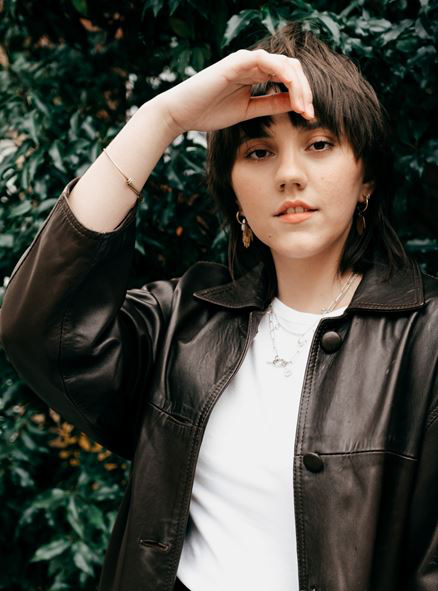 A woman wearing a leather jacket