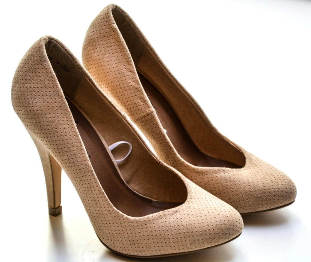 A pair of beige high heels