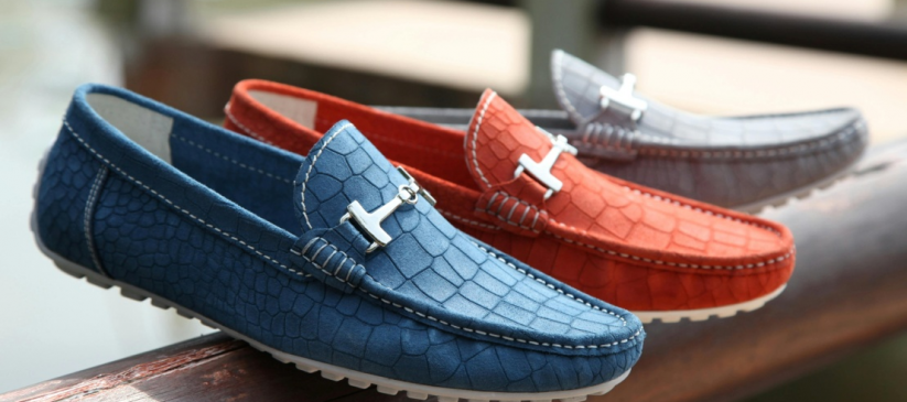 Three unpaired blue, red, and grey loafers