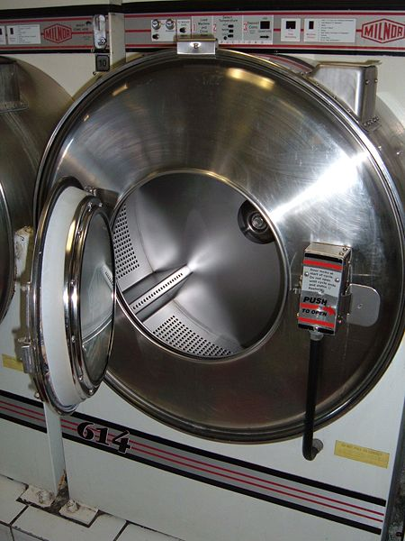 Industrial washing machines in a professional laundry service facility