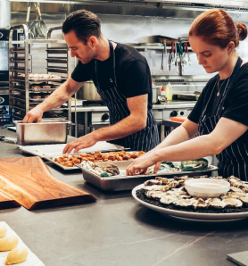 two caterers setting up