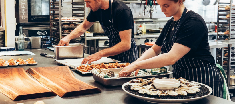 two caterers setting up