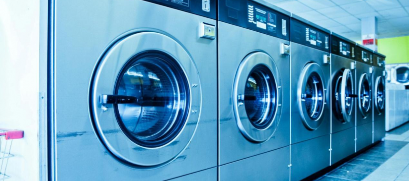 A picture showing blue washing machines lined together